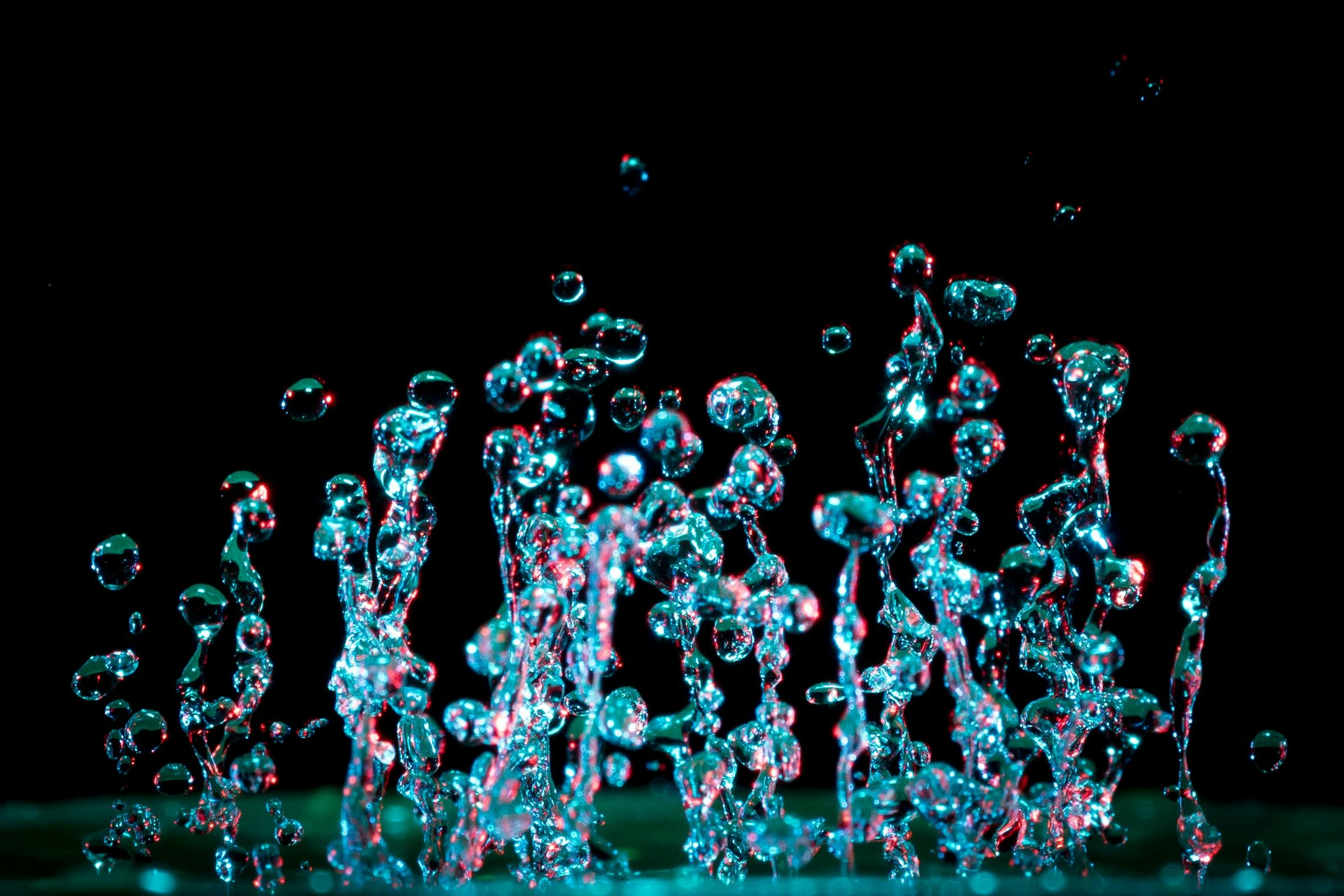 A striking close-up of vibrant water droplets capturing motion and abstract beauty.